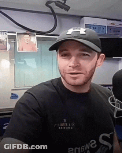 Man In Black Under Armour Hat And Shirt GIF
