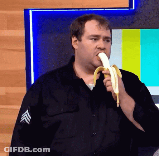 Man In Black Uniform Eating Banana GIF