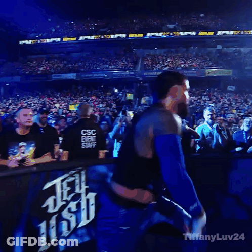 Man In Black Vest Blue Shorts Crowd Saying Tiffany GIF