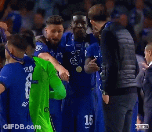 Man In Black Vest Next To Man In Green Soccer Jersey GIF