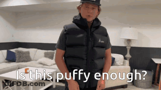 Man In Black Vest Saying Is This Puffy Enough GIF