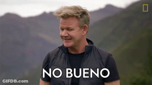 Man In Black Vest Says No Bueno In Mountains GIF