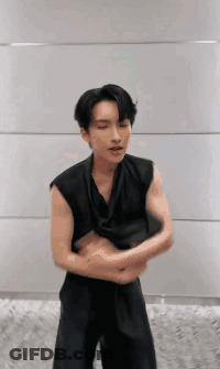 Man In Black Vest With Arms Crossed GIF