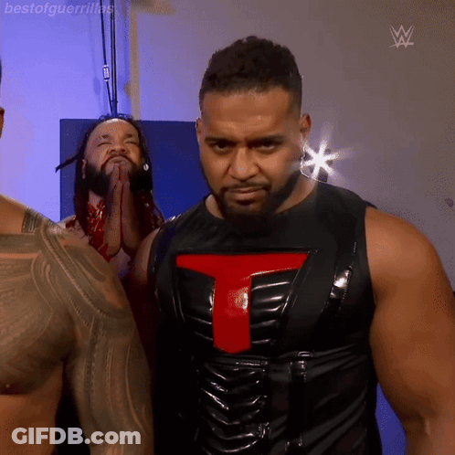 Man In Black Vest With Red Letter T GIF