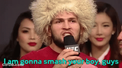Man In Blonde Wig Holding Microphone Says I Am Gonna Smash Your Boy Guys GIF