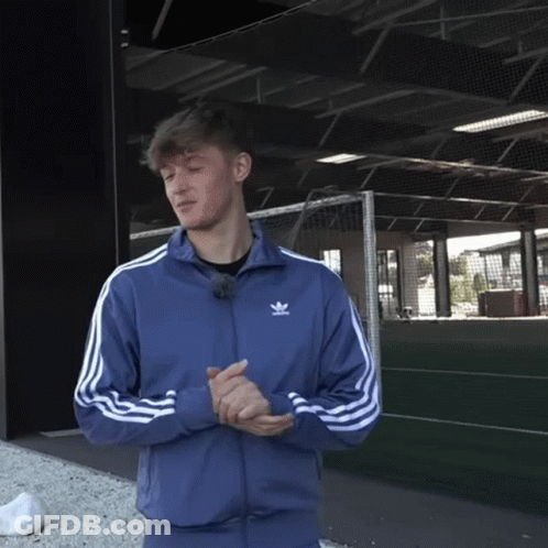 Man In Blue Adidas Jacket At Soccer Goal GIF