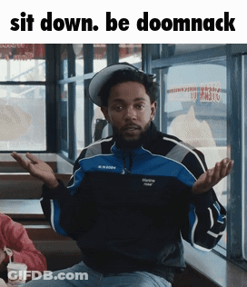 Man In Blue And Black Jacket Sitting GIF