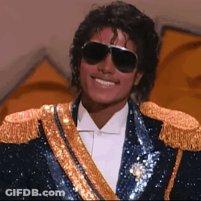 Man In Blue And Gold Jacket Saying Hello Chat GIF