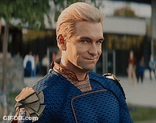 Man In Blue And Gold Outfit Smiling GIF