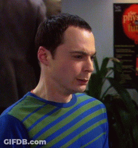Man In Blue And Green Striped Shirt In Front Of Plus Sign GIF