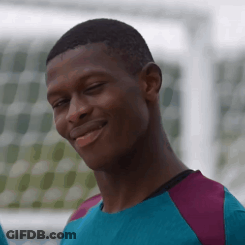 Man In Blue And Purple Smiling Eyes Closed GIF