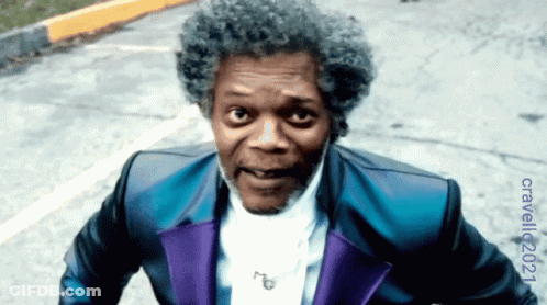 Man In Blue And Purple Suit On Street GIF