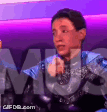 Man In Blue And Silver Suit At M Sign GIF