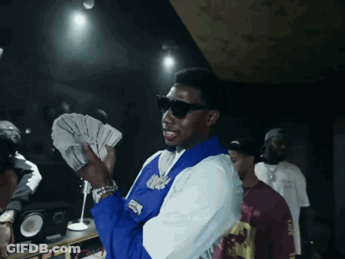 Man In Blue And White Jacket Holding Money GIF