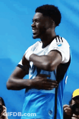 Man In Blue And White Jersey With Letter T GIF