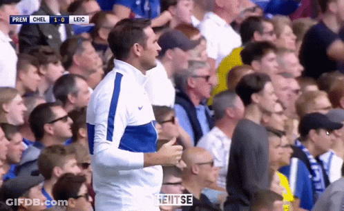Man In Blue And White Nike Jacket Watching Soccer Game GIF