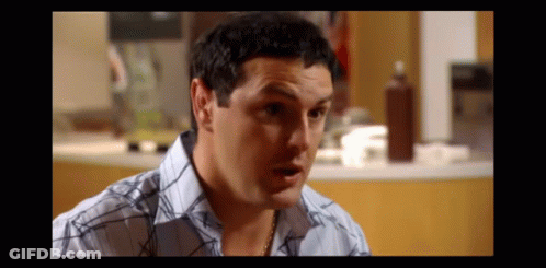 Man In Blue And White Plaid Shirt Making Funny Face GIF