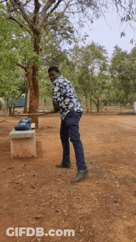 Man In Blue And White Shirt In Park GIF