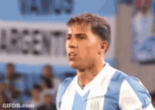 Man In Blue And White Striped Shirt In Front Of Argentina Banner GIF