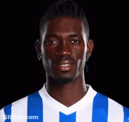 Man In Blue And White Striped Shirt Smiling GIF