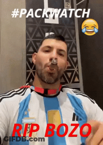 Man In Blue And White Striped Shirt Smoking GIF