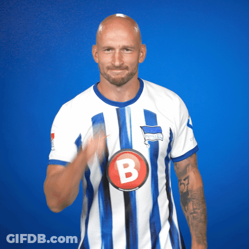 Man In Blue And White Striped Shirt With Letter B GIF