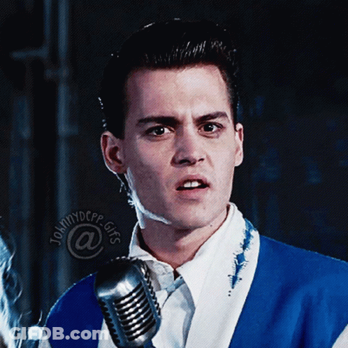 Man In Blue And White Suit At Microphone Johnny Depp GIF