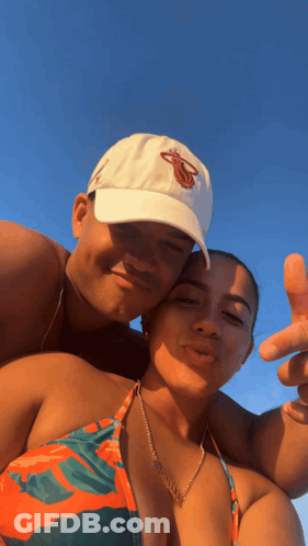 Man In Blue And White Sweater With Woman And Man In Suit GIF