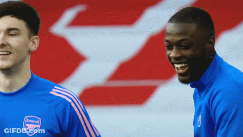 Man In Blue Arsenal Jersey Smiles GIF