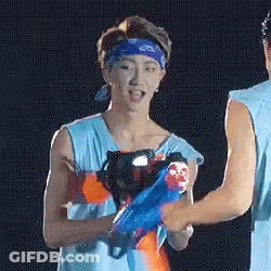Man In Blue Bandana Holding Water Gun GIF