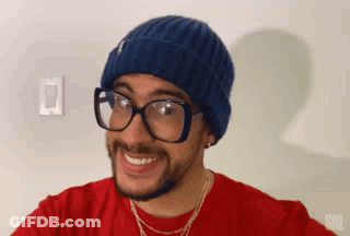 Man In Blue Beanie And Glasses Smiling GIF