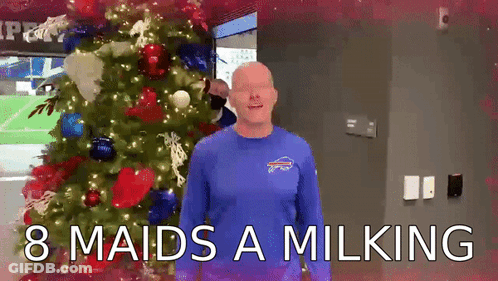 Man In Blue Bills Shirt By Christmas Tree GIF