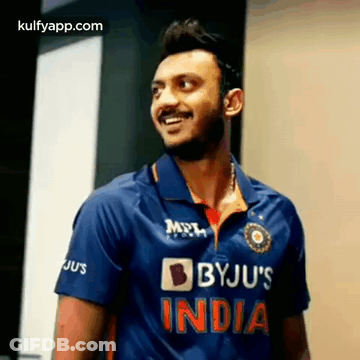 Man In Blue Byju's India Cricket Jersey Smiling GIF