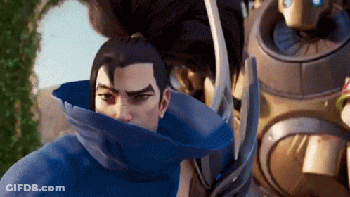 Man In Blue Cape With Robot Looking At Camera GIF