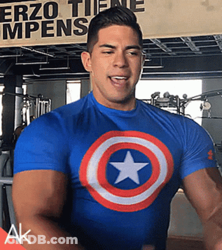 Man In Blue Captain America Shirt At Erzo Tiene Mpens Sign GIF