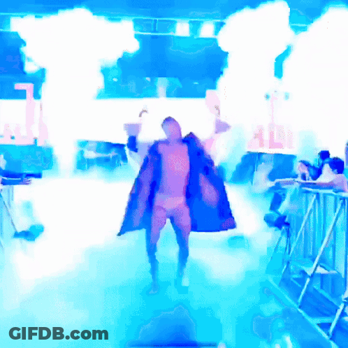 Man In Blue Coat Holding Adi Sign In Front Of Crowd GIF
