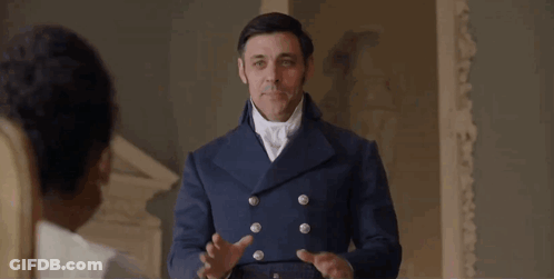 Man In Blue Coat Holding Hands Up GIF