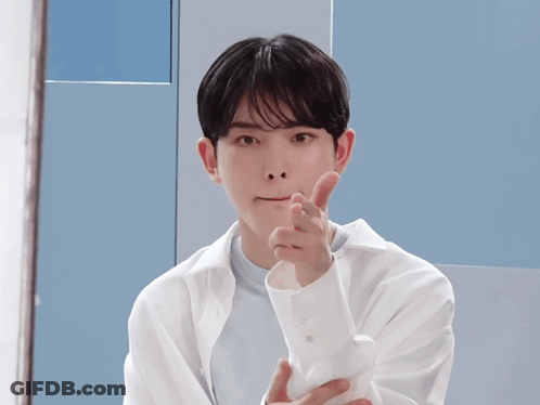 Man In Blue Coat Holding Up Hands GIF