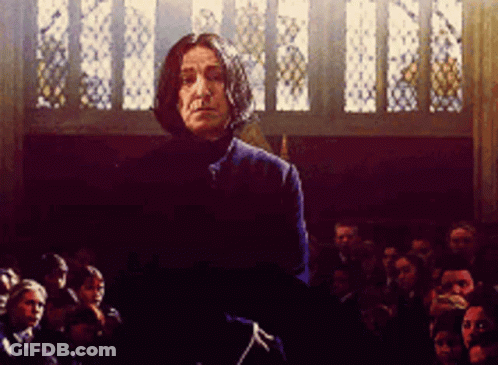 Man In Blue Coat In Front Of Crowd GIF