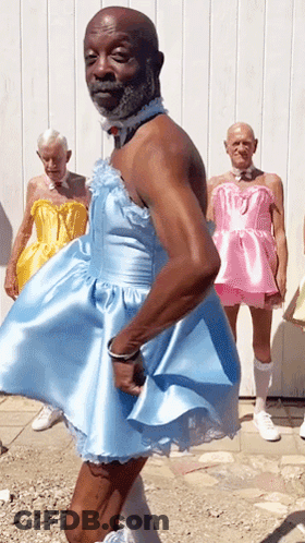 Man In Blue Dress With Men In Pink Dresses GIF