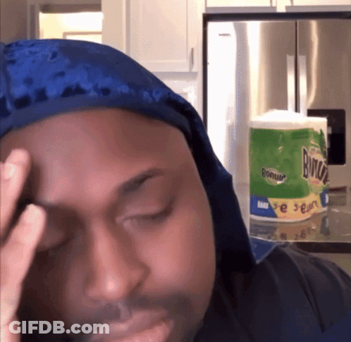 Man In Blue Du Rag Holding Head Before Bounty Toilet Paper GIF
