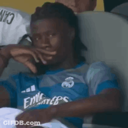Man In Blue Emirates Shirt Covering Mouth GIF
