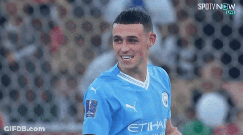 Man In Blue Etihad Jersey Smiling GIF