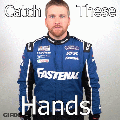 Man In Blue Fastenal Jacket And Catch These Hands Sign GIF