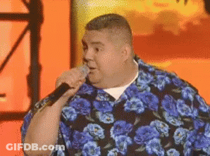 Man In Blue Floral Shirt Singing Into Microphone GIF
