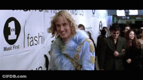 Man In Blue Fur Coat With Music First Sign GIF