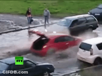Man In Blue Hard Hat By Flooding Pipe GIF