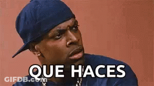 Man In Blue Hat And Blue Shirt Making Funny Face Saying Que Haces GIF