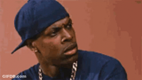 Man In Blue Hat And Chain Sitting Down GIF