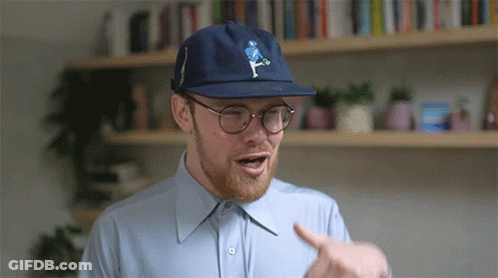 Man In Blue Hat And Glasses Pointing GIF